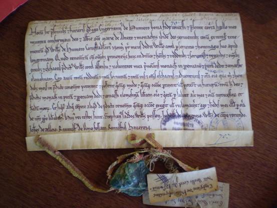Sealed charter of Enguerrand (II) du Hommet, confirming a grant made by his father William, constable of Normandy, to a certain William Cotel (undated, early 13th century).  Caen, AD Calvados, H 725 (reproduced by permission of the Archives du Calvados).