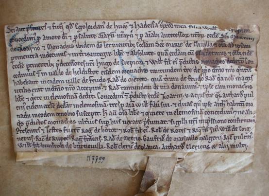 Charter of Jordan du Hommet and his wife Hawise de Crèvecœur for the abbey of Troarn near Caen, confirming the grant of the church of Cléville (Calvados, cant. Troarn) by Hawise's predecessors (late 12th century).  Caen, AD Calvados, H 7799 (reproduced by permission of the Archives du Calvados).